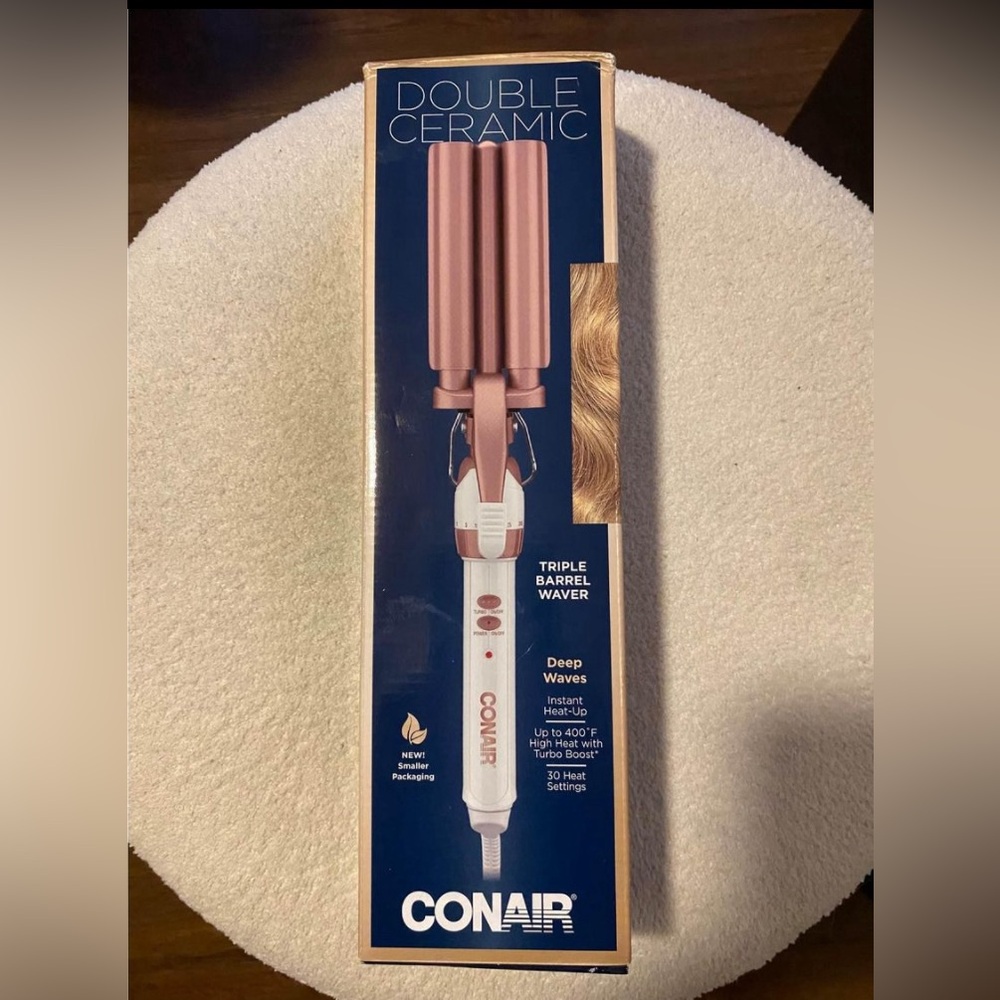 double ceramic barrrl curling iron 
BRAND NEW IN BOX…. HUGE PRICE SLASH!!!